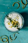 Lemon cream with lemon peel and basil — Stock Photo