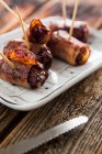 Bacon wrapped dates filled with cheese — Stock Photo