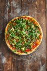 Close-up shot of delicious Pizza Caprice with arugula — Stock Photo