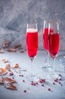 Three pomegranate champagne cocktails — Stock Photo
