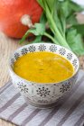 Cream of pumpkin soup with celery — Stock Photo