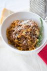 Tagliatelle with Bolognese Sauce and grated Parmesan — Stock Photo