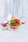 A veggie burger with cucumber and tomatoes — Stock Photo