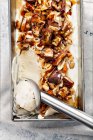 Snickers ice cream with caramel, fried peanuts and hazelnuts — Stock Photo