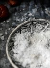 Salt flakes in a bowl — Stock Photo