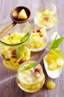 Pineapple punch with raspberries and pineapple ice cubes — Stock Photo