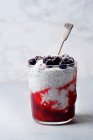 Chia pudding with strawberry smoothie and black currants — Stock Photo