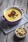 Chanterelle mushroom cream soup with thyme and croutons — Stock Photo