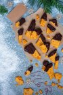 Homemade honeycomb dipped in dark chocolate for christmas, view from above — Stock Photo