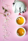 Tea set with cup and teapot as a tea time concept on pink background — Fotografia de Stock
