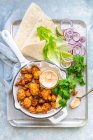 Fried cauliflower bites with cheese dip — Stock Photo