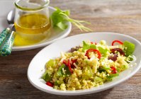Millet salad with cheese and vegetables, close up shot — Stock Photo