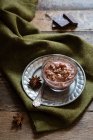 Chocolate rice pudding with star anise — Stock Photo