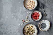 Oats, goji berries, chia seeds and nuts — Stock Photo