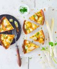 Several pieces of asparagus quiche — Stock Photo