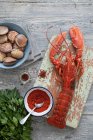 Lobster and clams with a selection of ingredients — Stock Photo