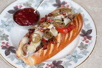 Steak with cheese, jalapenos and peppers in a hot dog roll — Stock Photo