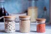 Quinoa, beans and lentils in jars — Stock Photo