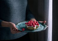 A star shaped ricotta cake with raspberries — Stock Photo
