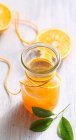 Homemade orange syrup with fresh fruits — Stock Photo