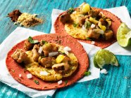 Lebanese style Tempeh street tacos with grilled pineapple on beet tortillas — Stock Photo