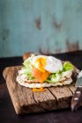 Waffle sandwich with salmon and a poached egg — Foto stock