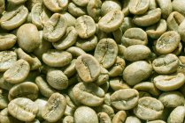 Close-up shot of Green coffee beans - foto de stock
