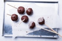 Vegan cakepops with rice milk chocolate and grated coconut — Stock Photo