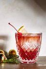 Old Fashioned cocktail in glass with lemon slice and cherry — Stock Photo