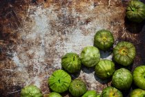 Close-up shot of delicious Tomatillos on a rusty surface — Stock Photo