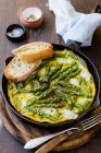 Asparagus and goat cheese frittata, bread, sald and pepper — Stock Photo