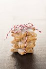 Stack of cinnamon stars tied with string — Stock Photo