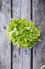 Fresh herbs bunch on rustic wooden surface — Stock Photo
