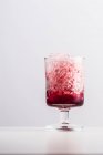 Crushed ice with pomegranate juice in glass — Stock Photo