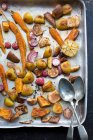 Roasted vegetables on a baking tray — Stock Photo