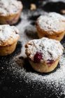 Raspberry muffins with powdered sugar — Stock Photo