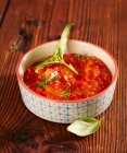Fiery-spicy tomato sauce as a dip for a fondue — Stock Photo