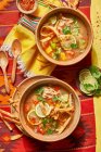 Mexican soup with tortillas and lime — Stock Photo