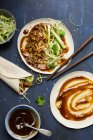 Vegan Chinese Jackfruit 'duck style' pancakes being made on a dark blue background — Stock Photo