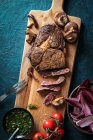 Ribeye steak with chimichurri sauce, mushrooms and salad — Stock Photo