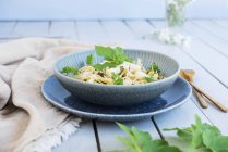 Pasta with white asparagus, cheese and ground-elder — Stock Photo