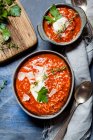 Tomato soup with rice, minced meat and parmesan shavings — Stock Photo