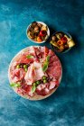 Prosciutto sandwich with ham, salami, cheese and olives. top view. — Photo de stock