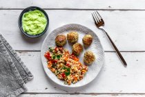 Chia falafel with pepper couscous tabbouleh and a wasabi dip — Stock Photo