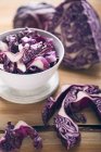 Close-up shot of Red cabbage, partly cut into strips — Stock Photo