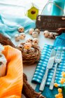 Easter table setting with eggs in nest — Stock Photo