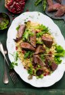 Lamb fillet with pomegranate couscous — Stock Photo