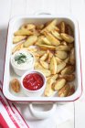 Homemade fries with dips — Stock Photo