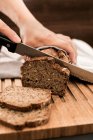 Home-baked wholegrain bread cut into slices — Stock Photo