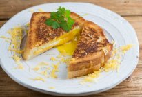 Grilled cheese sandwich with egg — Stock Photo